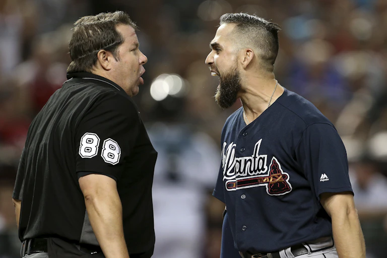 Two men, face to face, argue