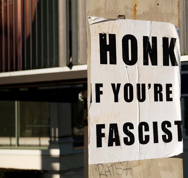 A poster that says "Honk if you're fascist"