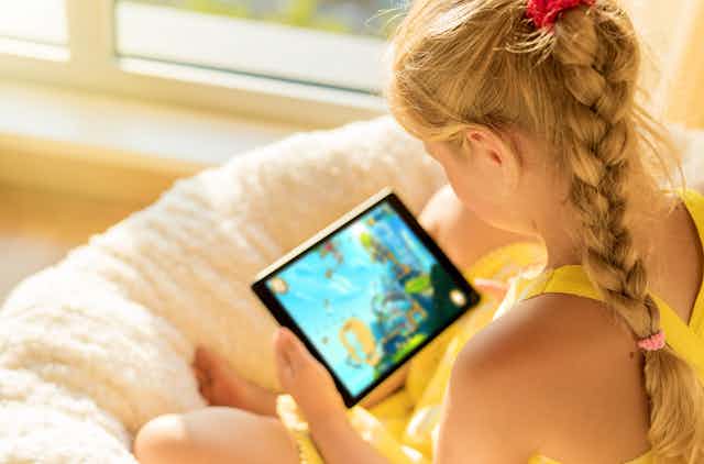 Girls watches a video on a tablet