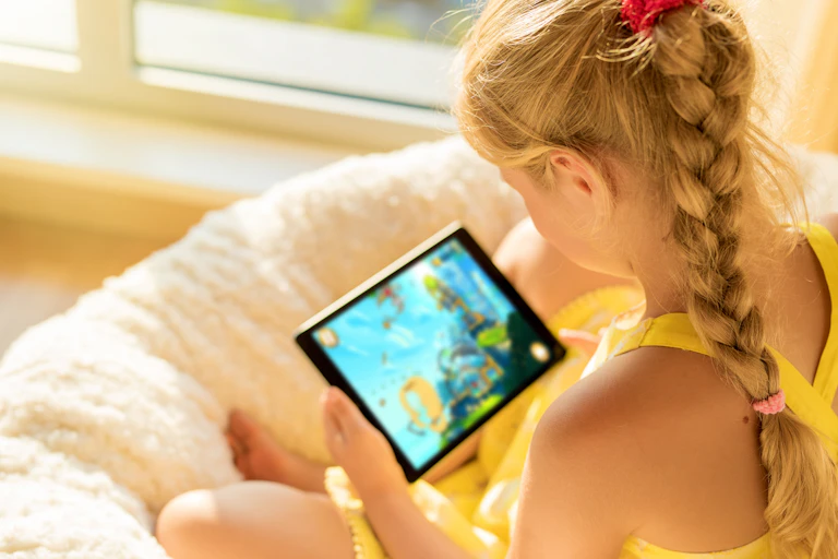 Girls watches a video on a tablet