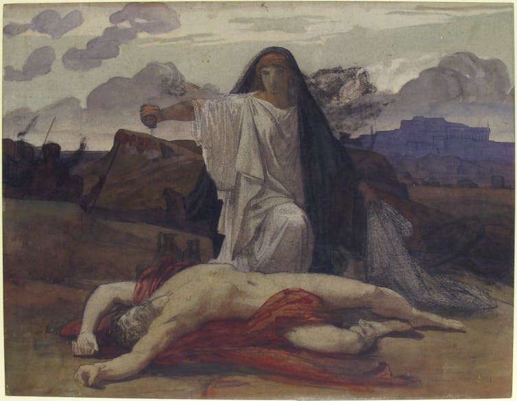 Una mujer extendiendo algo en su mano sobre el cadáver de un hombre que yacía frente a ella.