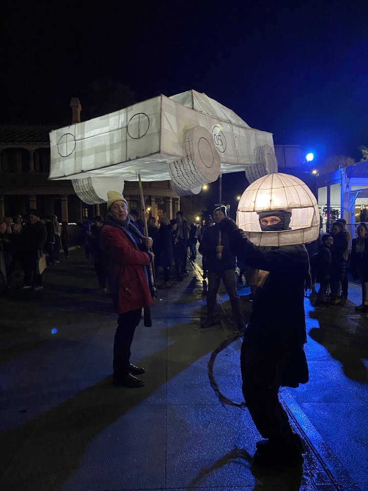 A paper lantern in the shape of a car.