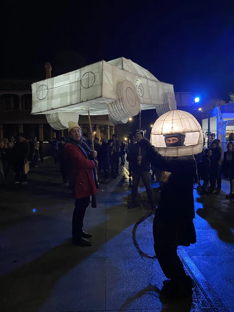 A paper lantern in the shape of a car.