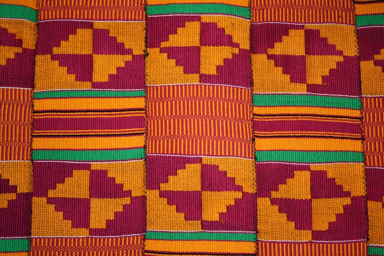 Brightly coloured patterned kente fabric from Ghana.