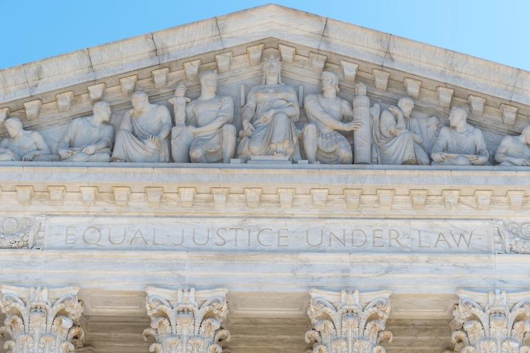Front of a white building carrying the words: equal justice for all