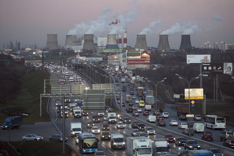 urban scene with cars and coal stacks