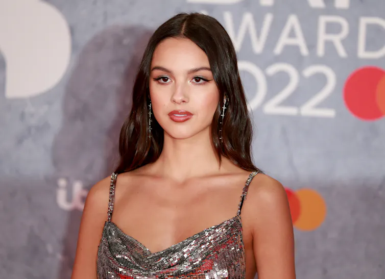 A woman poses on the red carpet