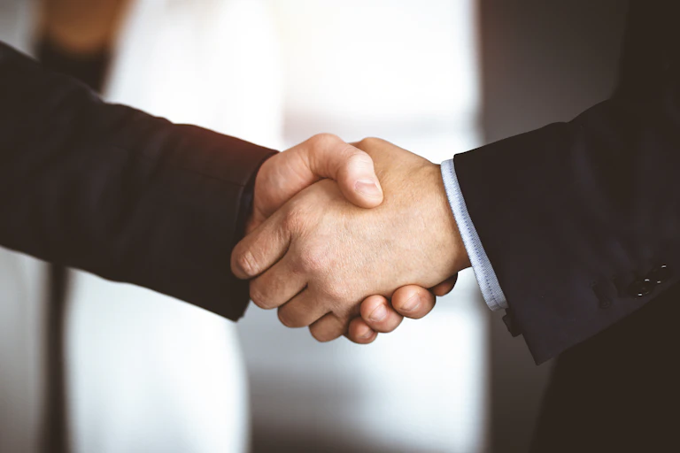 Unknown men shaking hands