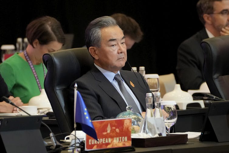 Chinese Foreign Minister Wang Yi sits listening to a speech at the G20 Foreign Ministers’ Meeting in Nusa Dua, Bali.