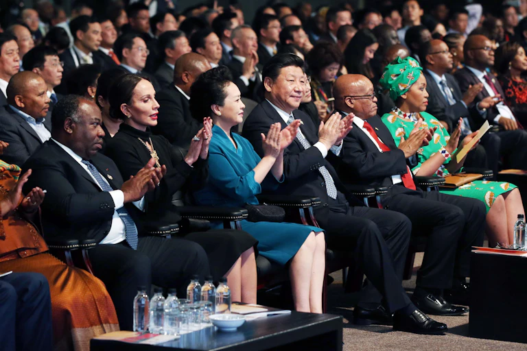 A line of people clapping.