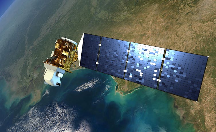 An illustration of a satellite with a large solar panel for power high over a coastal area