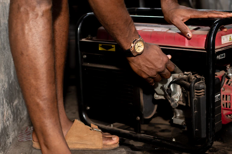 Man's hands on a piece of machinery
