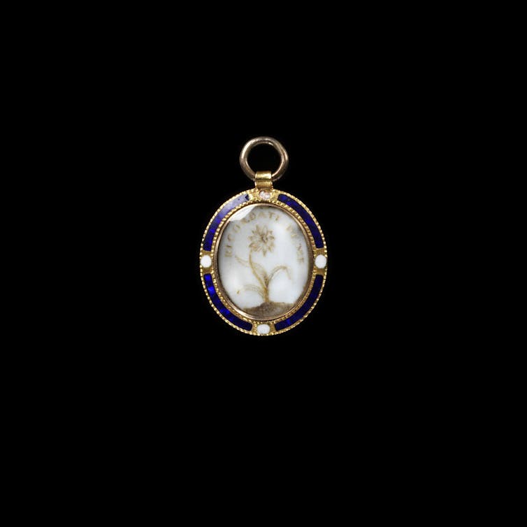 A gold pendant.