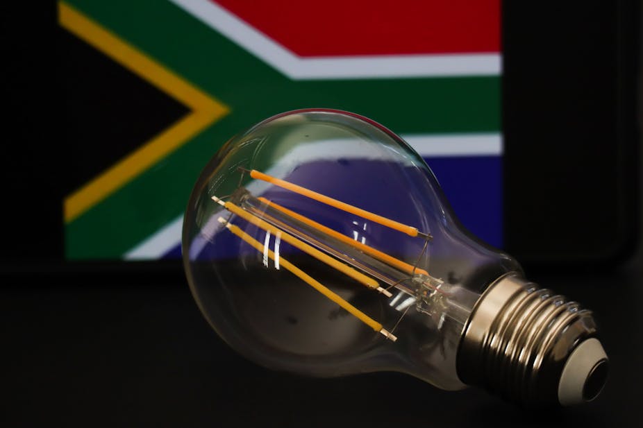 Picture of a light bulb in front of the South African flag.