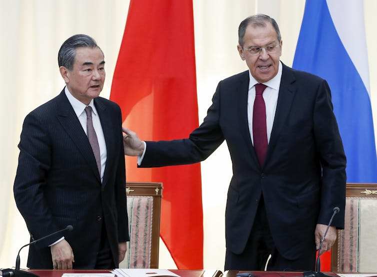 Russian Foreign Minister Sergei Lavrov (R) and Chinese Foreign Minister Wang Yi (L) leave their joint news conference following the talks in Sochi, Russia, 13 May 2019.