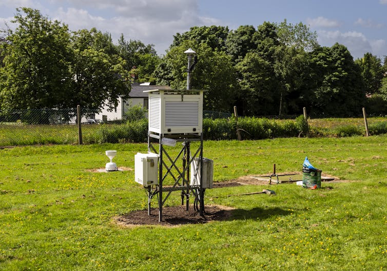 A white box on stilts with a tube protruding from the roof.