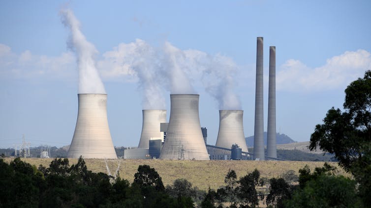 coal plant with steam coming from stacks