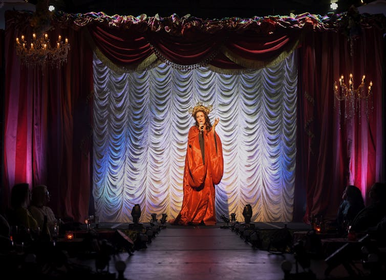 Moira Finucane in a red cape.