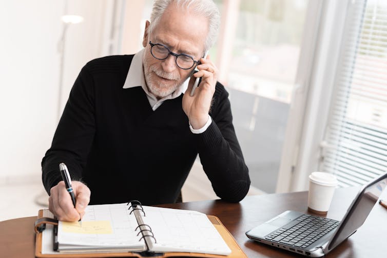 older man on phone