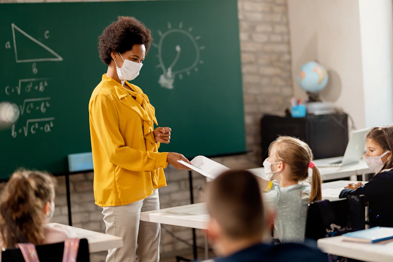 Teacher and pupils in masks
