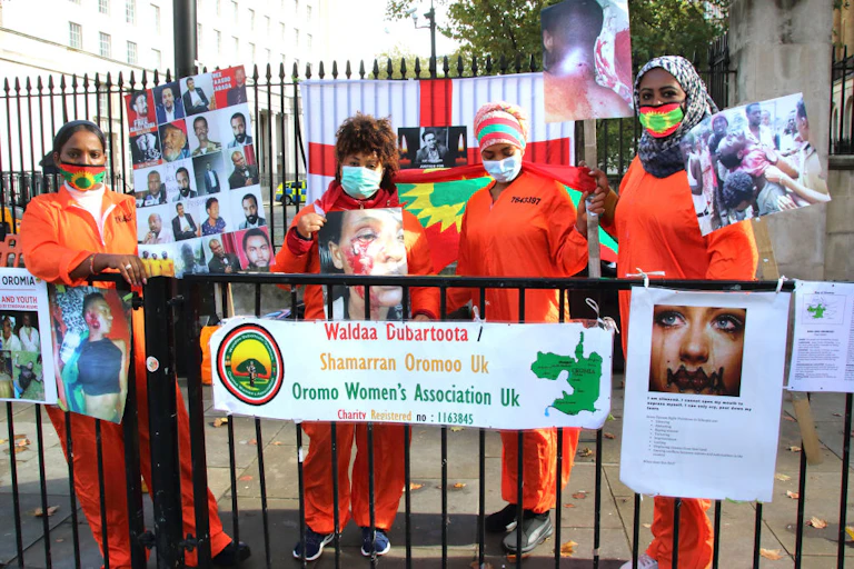 Women protesting on a street.