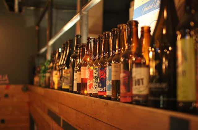 Bottles of BrewDog beer on the shelf at a beer festival.