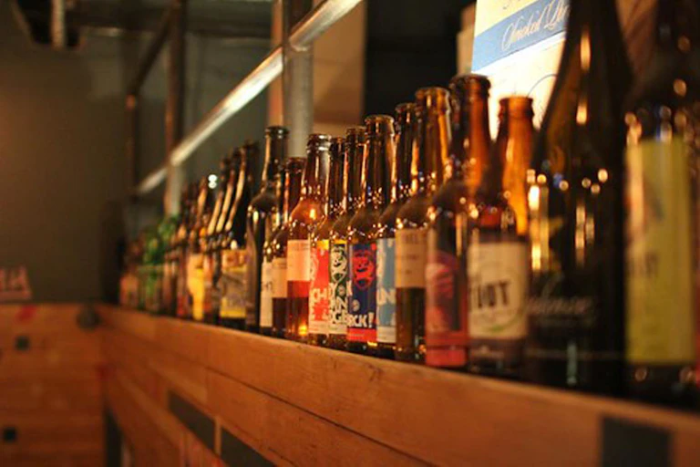 Bottles of BrewDog beer on the shelf at a beer festival.