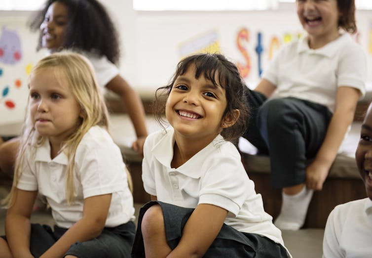 School pupils laughing.