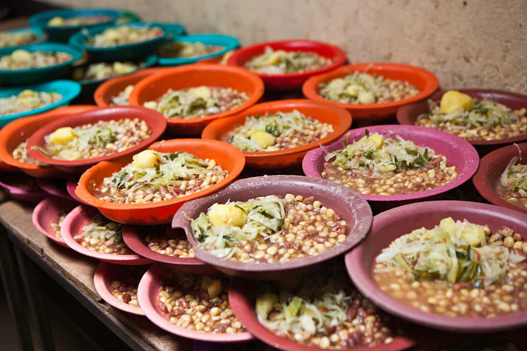 Plates of food stacked on a table ready to be given out to the pupils at Kibera School, in Nairobi, Kenya.