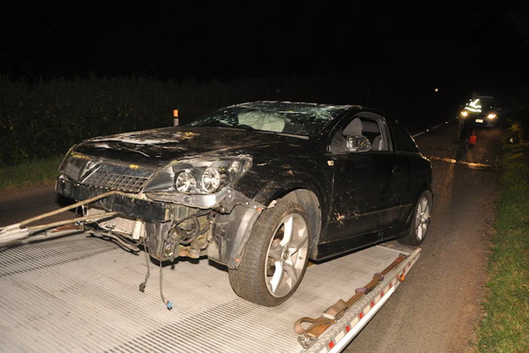 A damaged black car