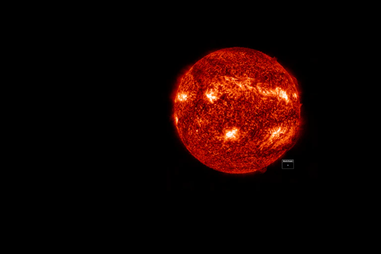 Glowing orange and dark red orb against a black background.