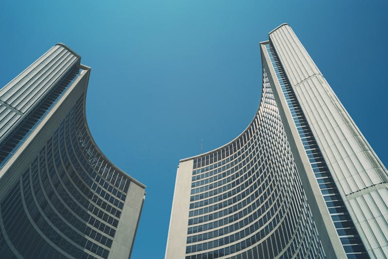 Two tall curved buildings