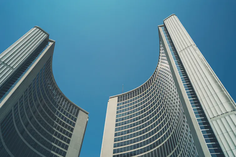 Two tall curved buildings