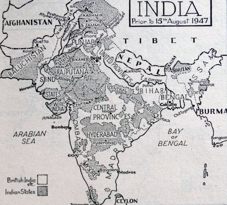 A black and white map shows India before independence from the United Kingdom.