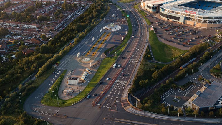 Launch pad with small runways surrounded by houses, roads and a stadium.
