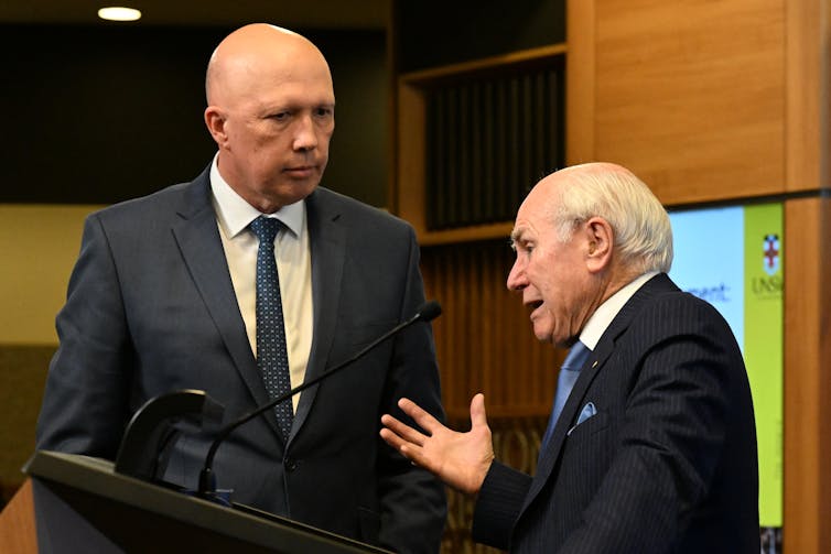 Liberal leader Peter Dutton speaking to former Prime Minister John Howard.