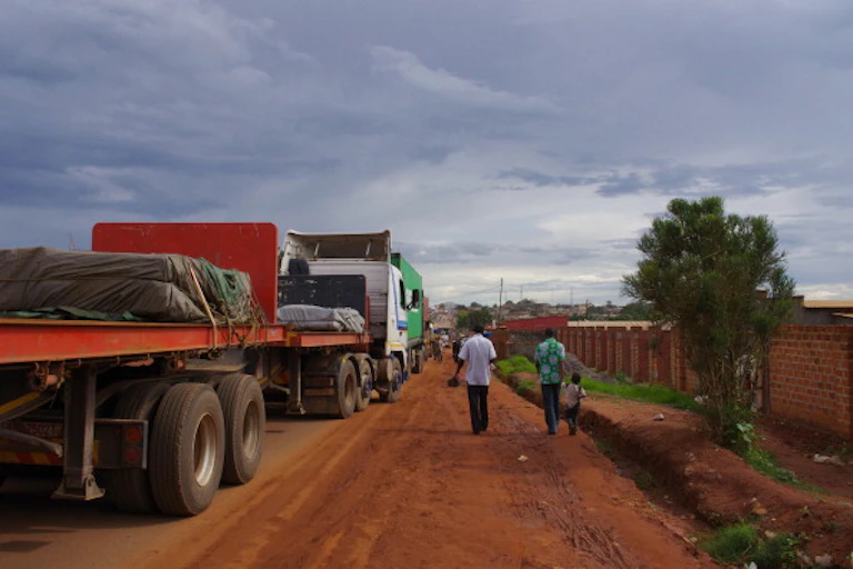 People walking along a major road