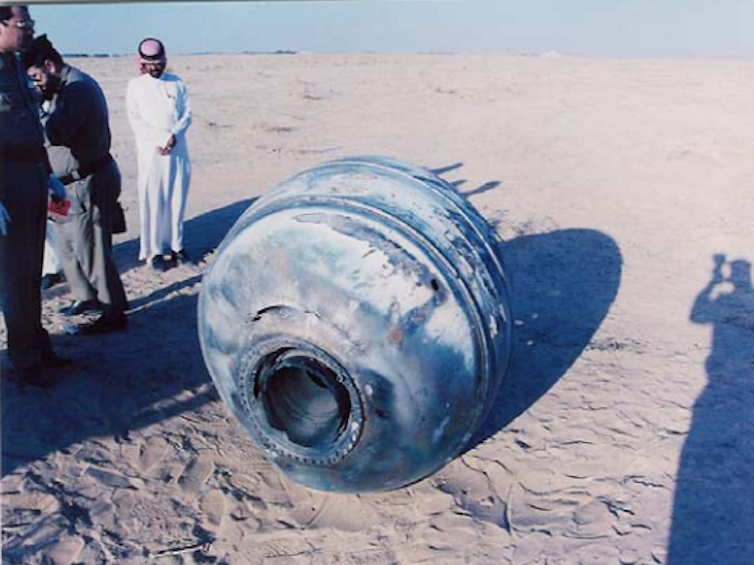 Image of Saudi officials inspect a crashed module in January 2001.