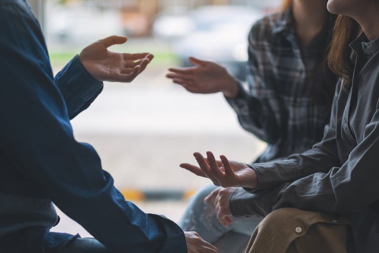 people sitting and talking together