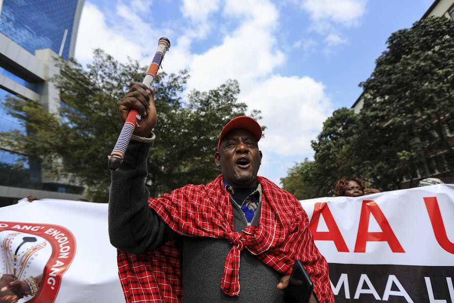 A member of the Kenyan Maasai community shouts slogans during a protest march