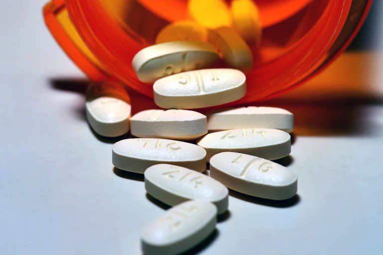 Pills spilling out of a bottle