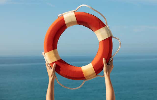 A life preserver held aloft over water