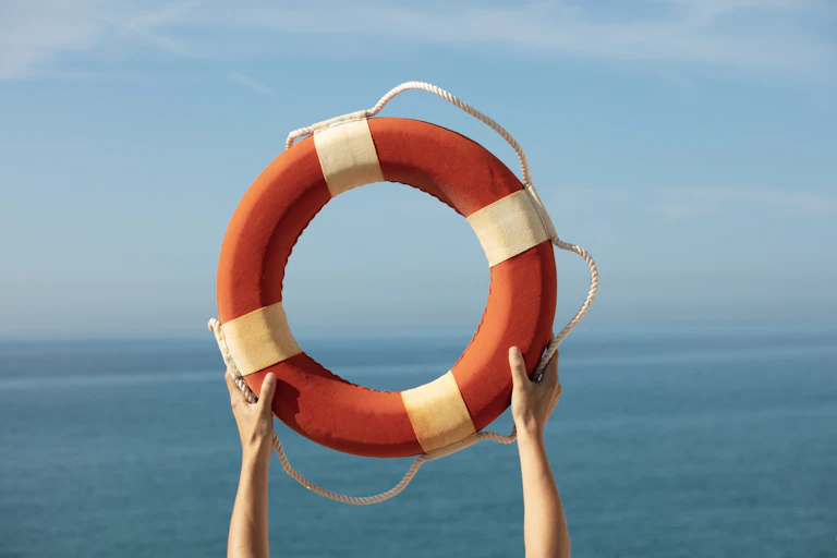 A life preserver held aloft over water