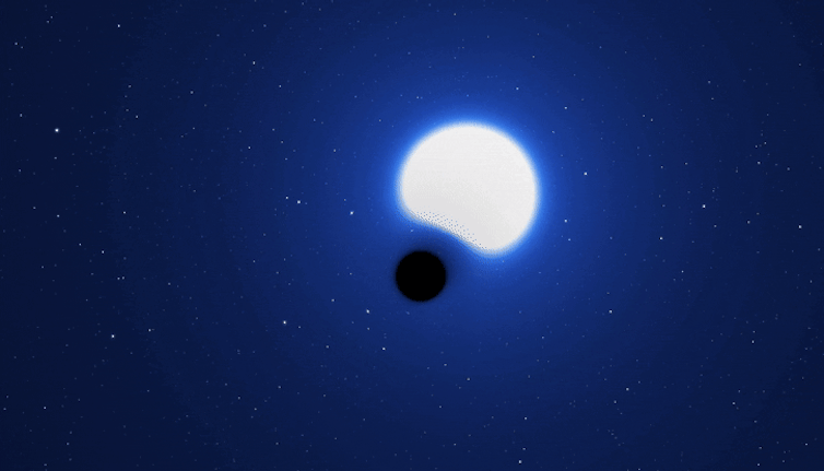 A black dot and a big blue star spinning around each other.