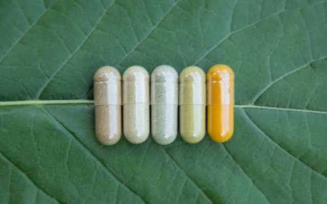 Five pills on a leaf