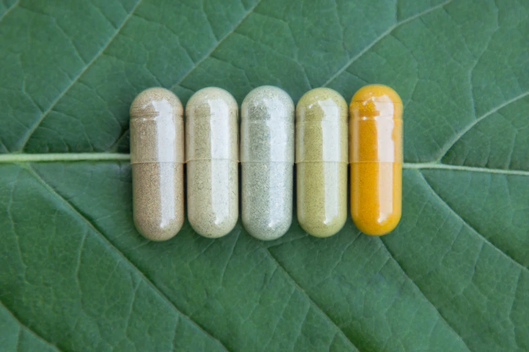 Five pills on a leaf