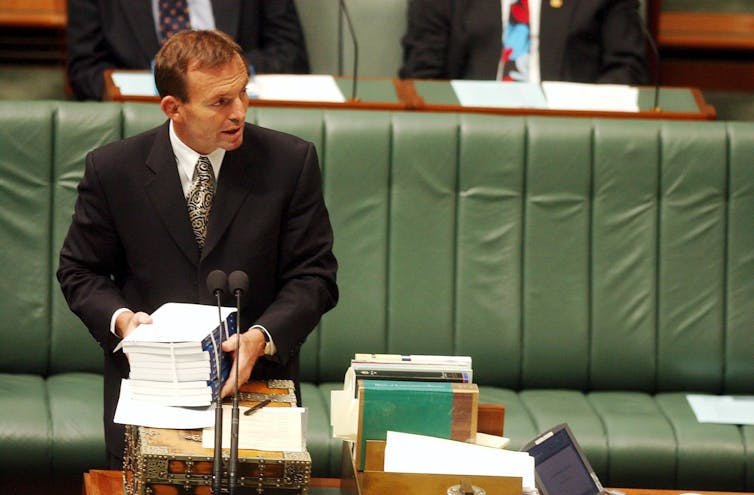 Workplace relations minister Tony Abbott tables the report of the Cole royal commission into the building and construction Industry on March 27 2003.