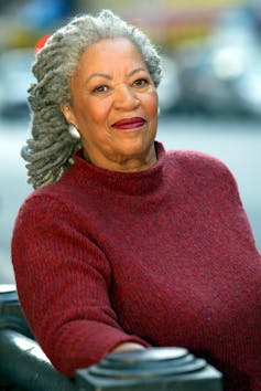 Toni Morrison leaning on a rail