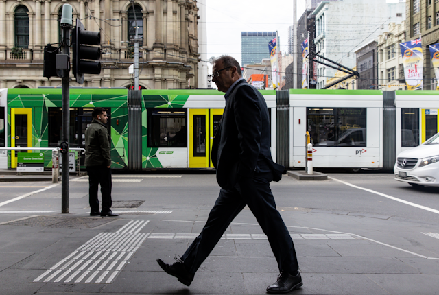 Man walks down a Melbourne city street