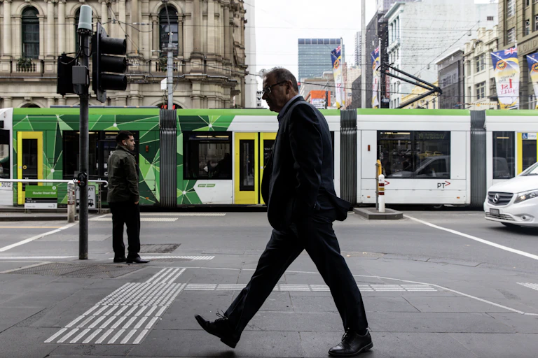 Man walks down a Melbourne city street